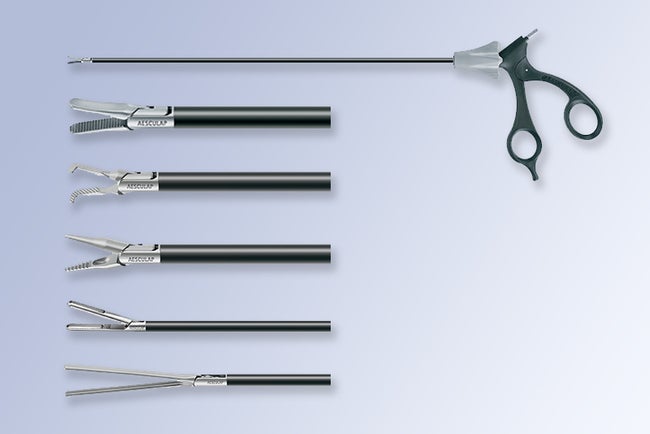 Laparoscopic hand held instrument and five varieties of tip designs
