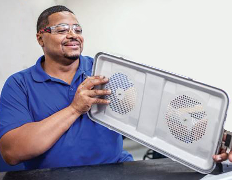 Aesculap technician examining SterilContainer lid