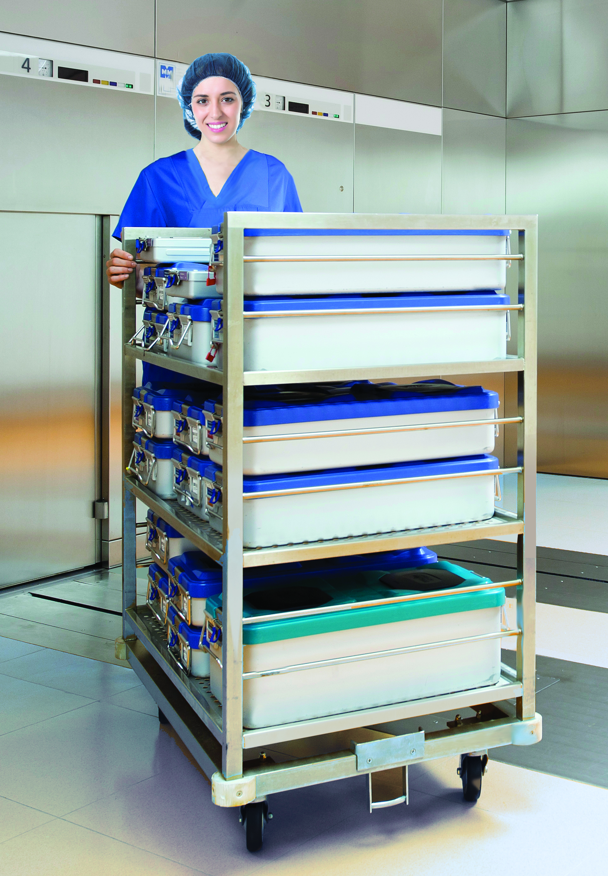 Woman in scrubs pushing cart with sterile containers