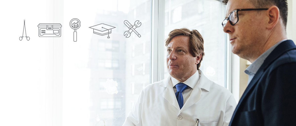 Close-up of doctor wearing stethosope and medical icons in background