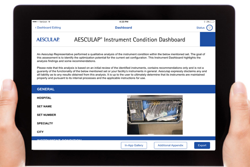 Hands holding computer tablet with Aesculap Instrument Dashboard on screen