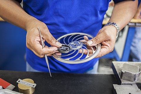 Aesculap technician examining SterilContainer part