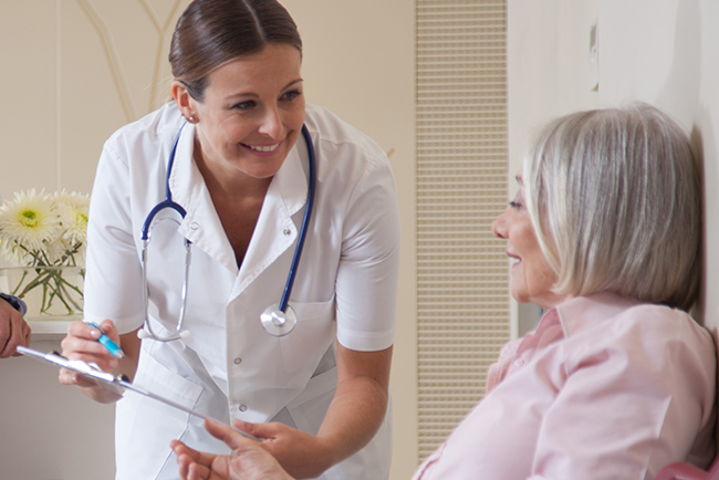 Nurse speaking with patient